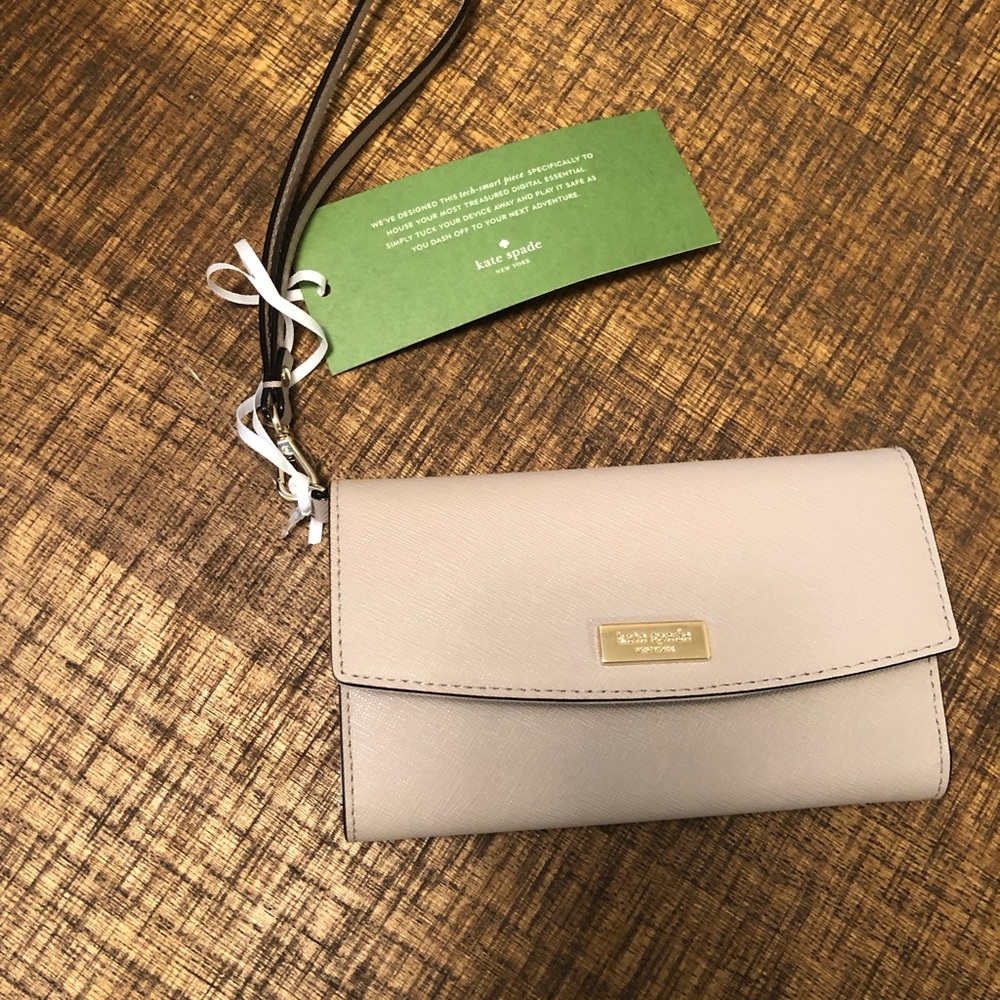 Brand new Kate Spade cream Wrist wallet
